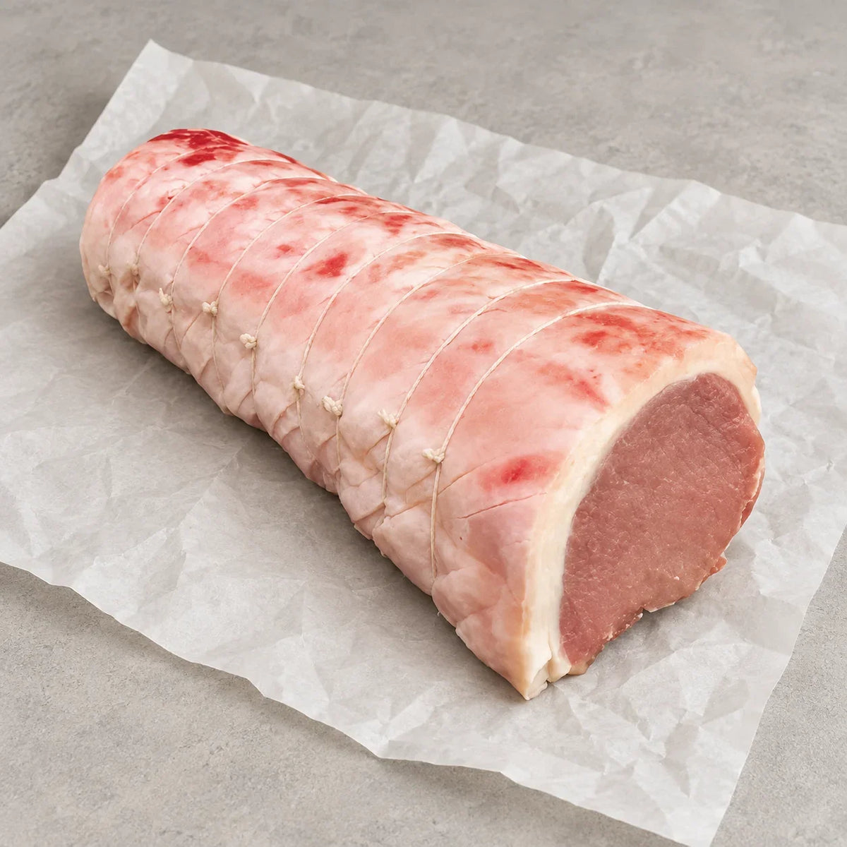 Traditional Pork Loin Joint from Bromfields Pork on white parchment paper
