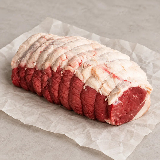 Bromfields Beef Silverside Roasting Joint tied with butcher's twine on parchment paper