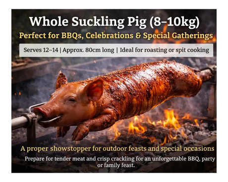 Whole suckling pig roasting on a spit