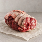 Raw Bromfields Lamb New Season Welsh Spring Leg of Lamb, tied and resting on parchment paper