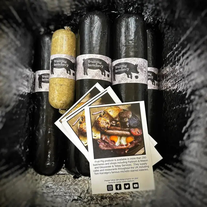 Fresh Fruit Pig Black Pudding and recipe cards displayed in a packaging, showcasing gourmet artisanal food products.