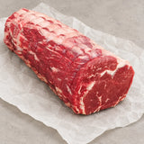 Bromfields Beef 28 Day+ Dry Aged Welsh Rolled Rib-Eye Joint on white parchment paper