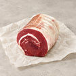 Rolled boneless brisket roasting joint from Bromfields Beef on white parchment paper