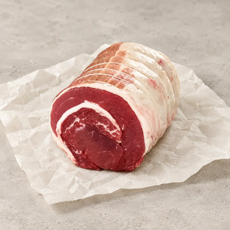 Rolled boneless brisket roasting joint from Bromfields Beef on white parchment paper